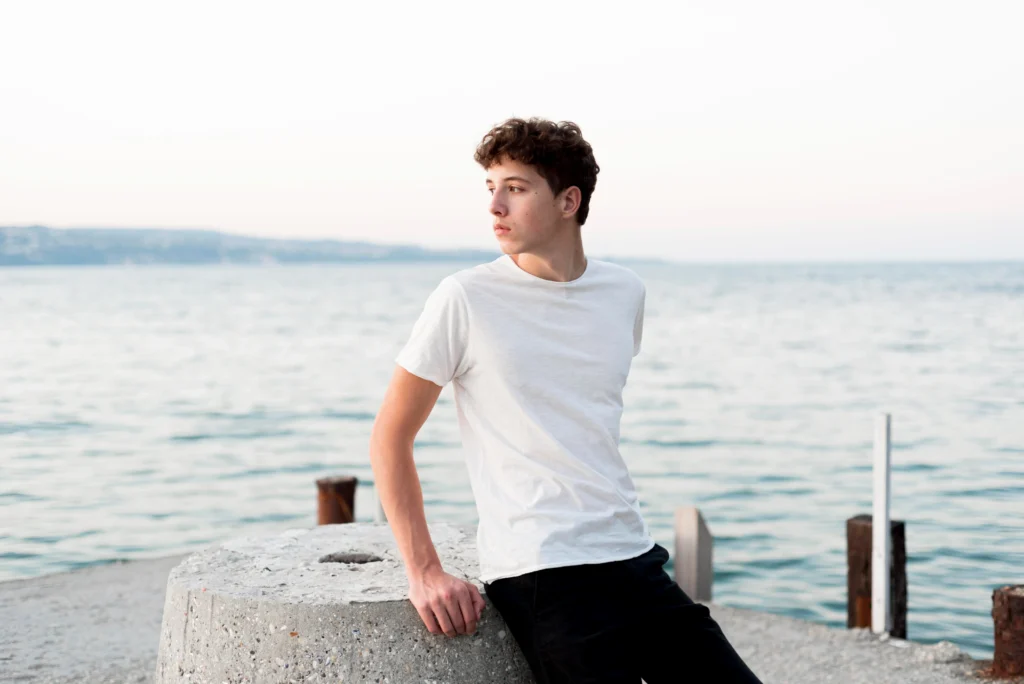 boy relaxing spending time sea