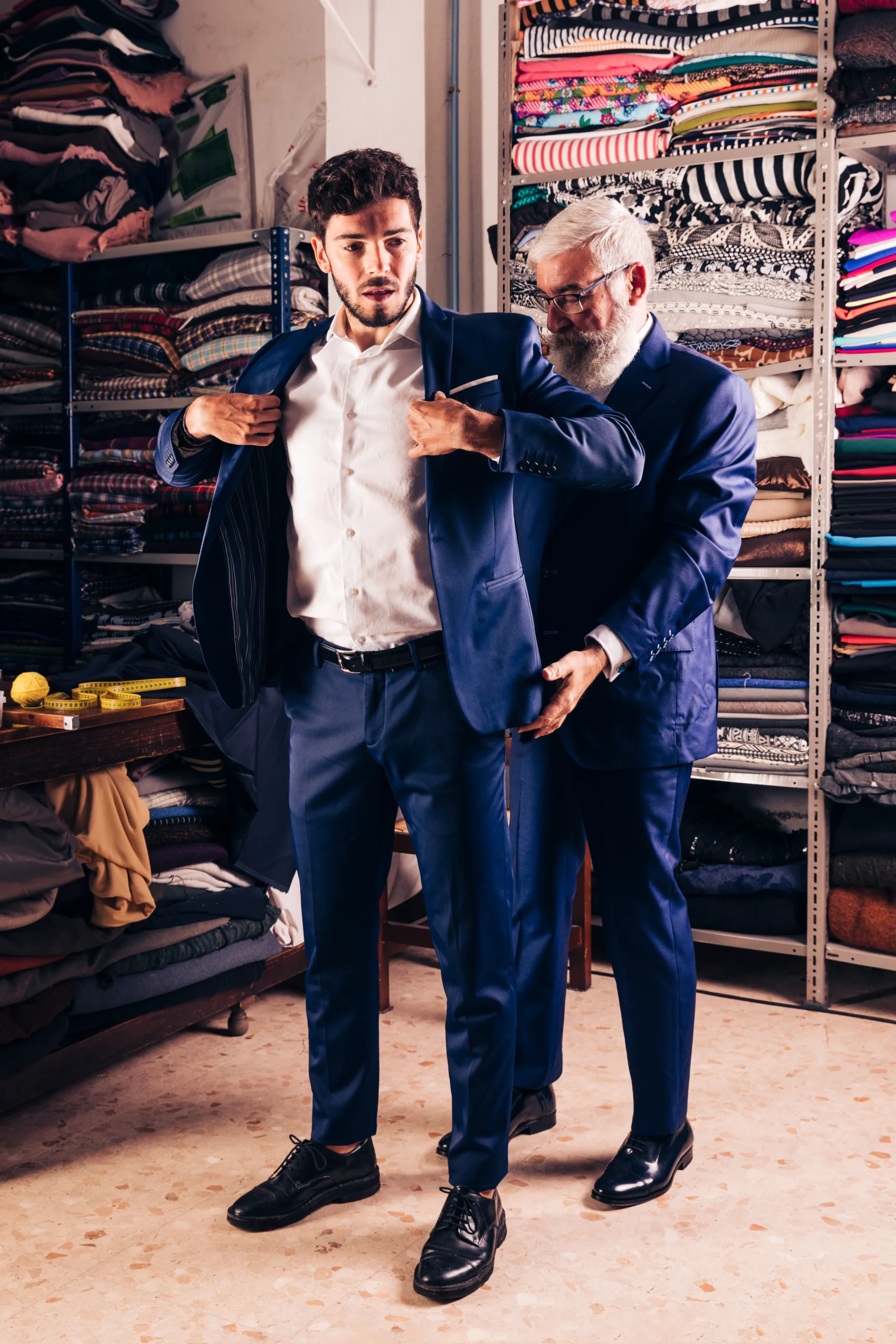 portrait handsome male customer trying coat shop