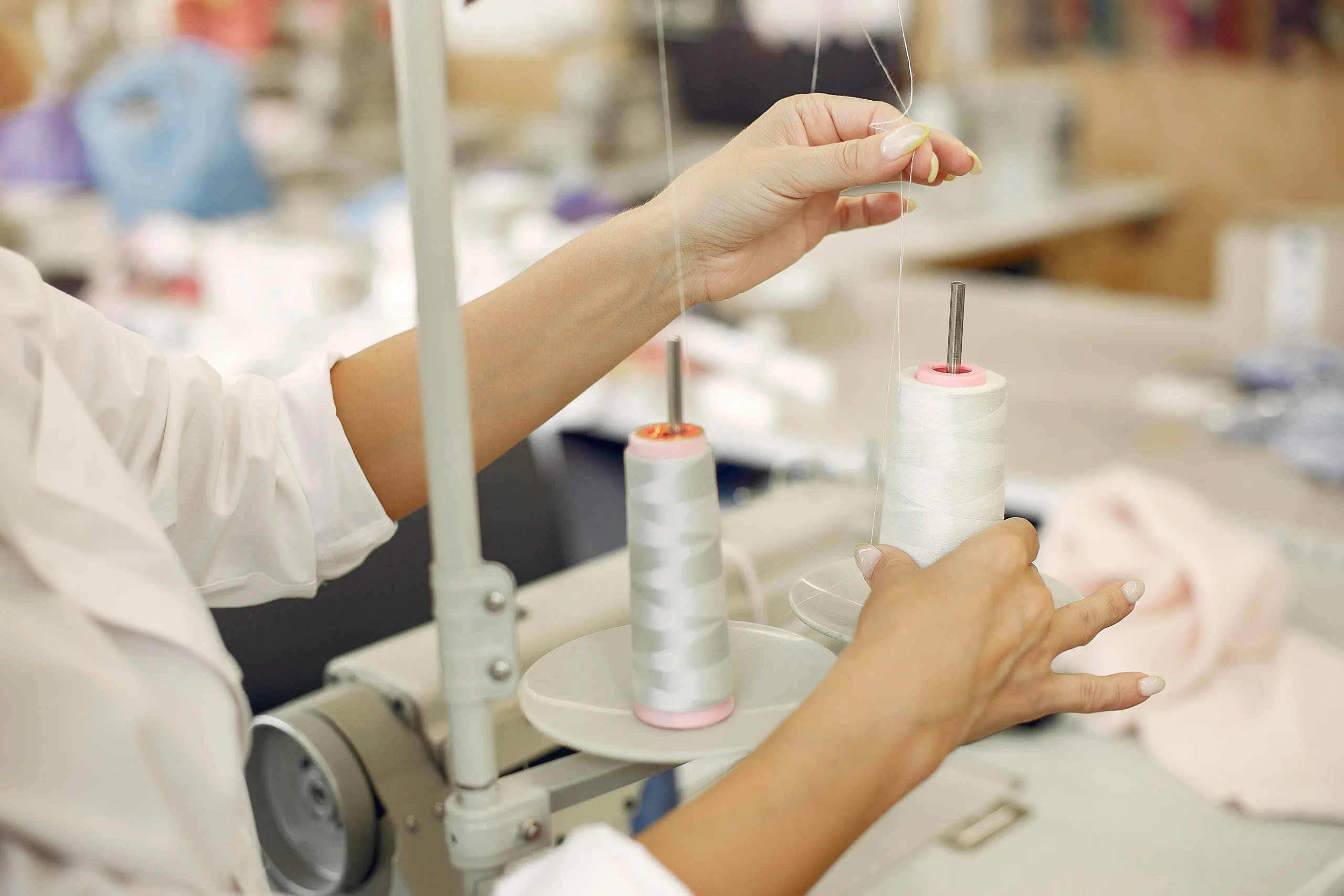 woman standing factory with thread