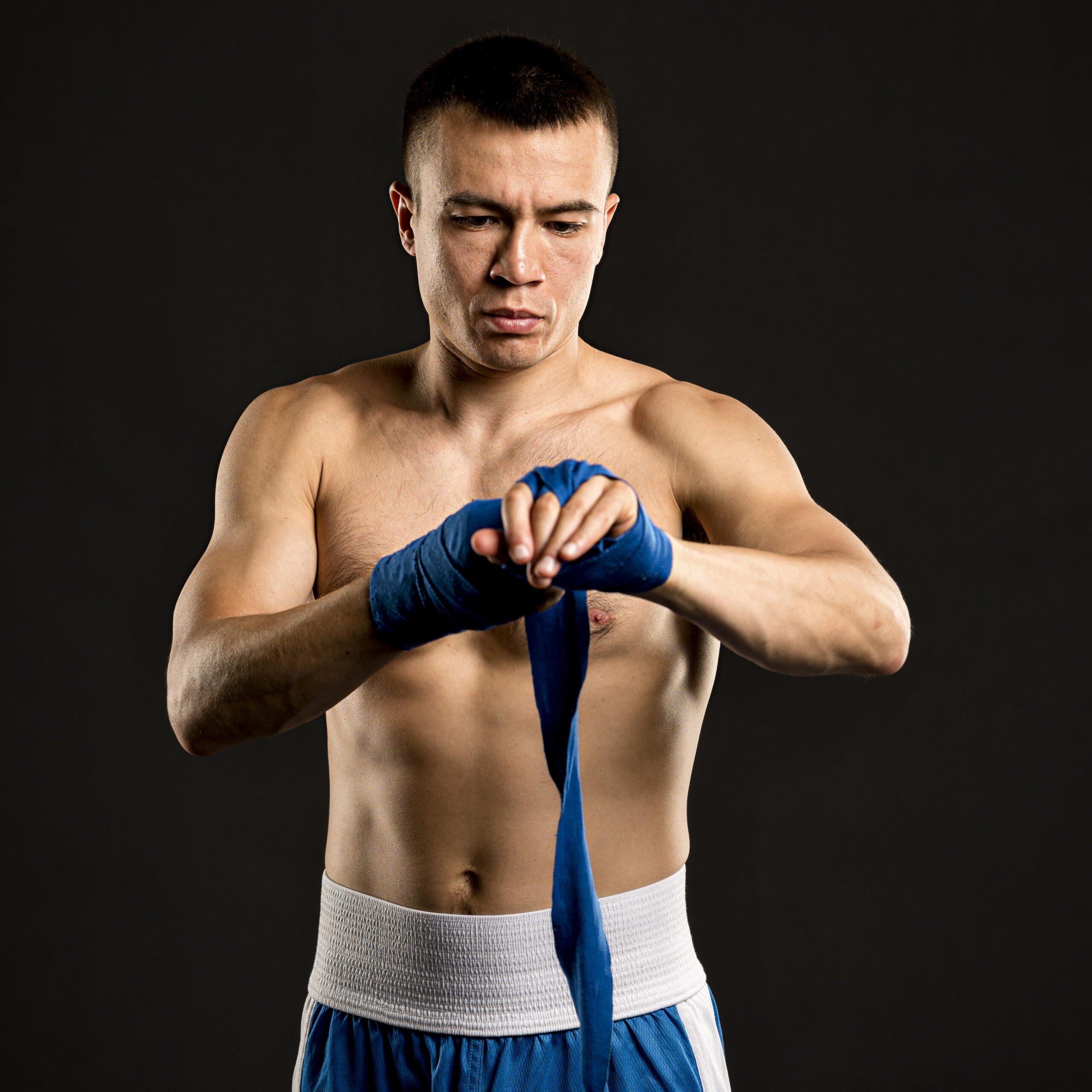 front-view-male-boxer-putting-protection-hands front-view-male-boxer-putting-protection-hands